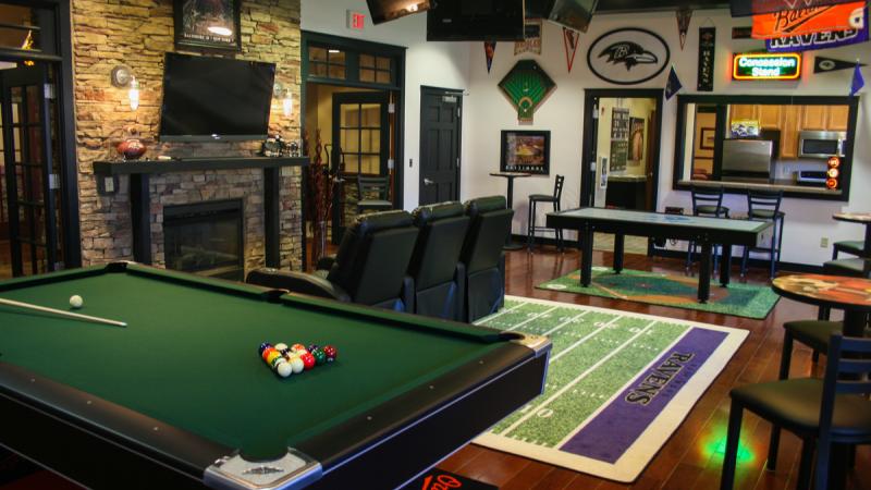 Community room with a fireplace and pool table