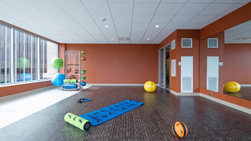 Fitness room with a yoga mat and exercise balls