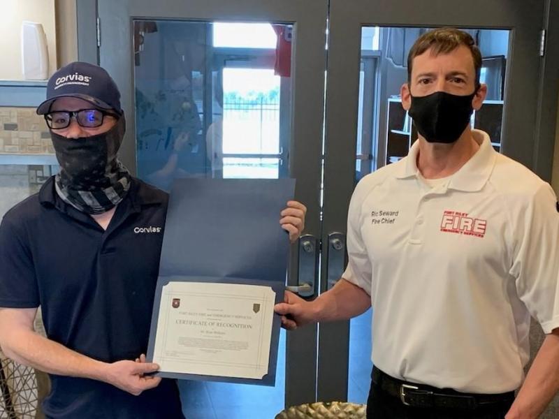 Fort Riley Fire Chief presents Ryan Welborn with certificate of recognition