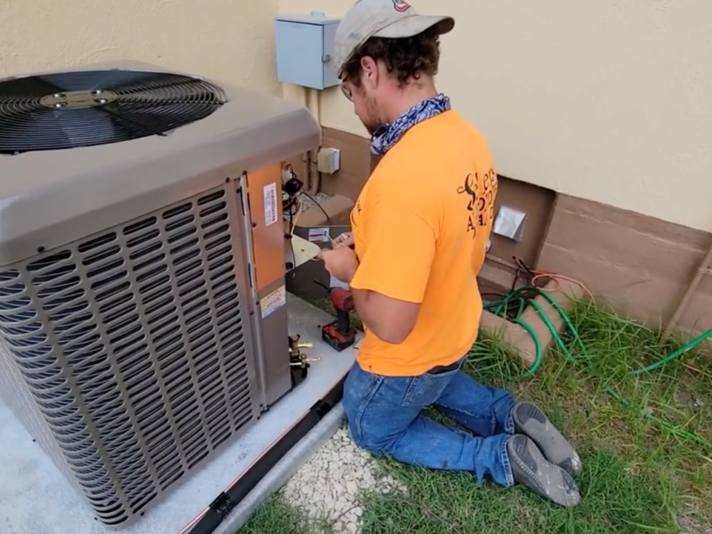 Technician at Fort Sill installs a new energy-efficient HVAC system as part of the $325 million Solutions Investment by Corvias to enable energy resilience and modernization across six Army installations.