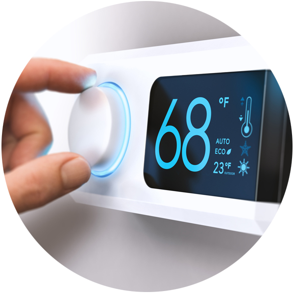 Person adjusting smart thermostat.