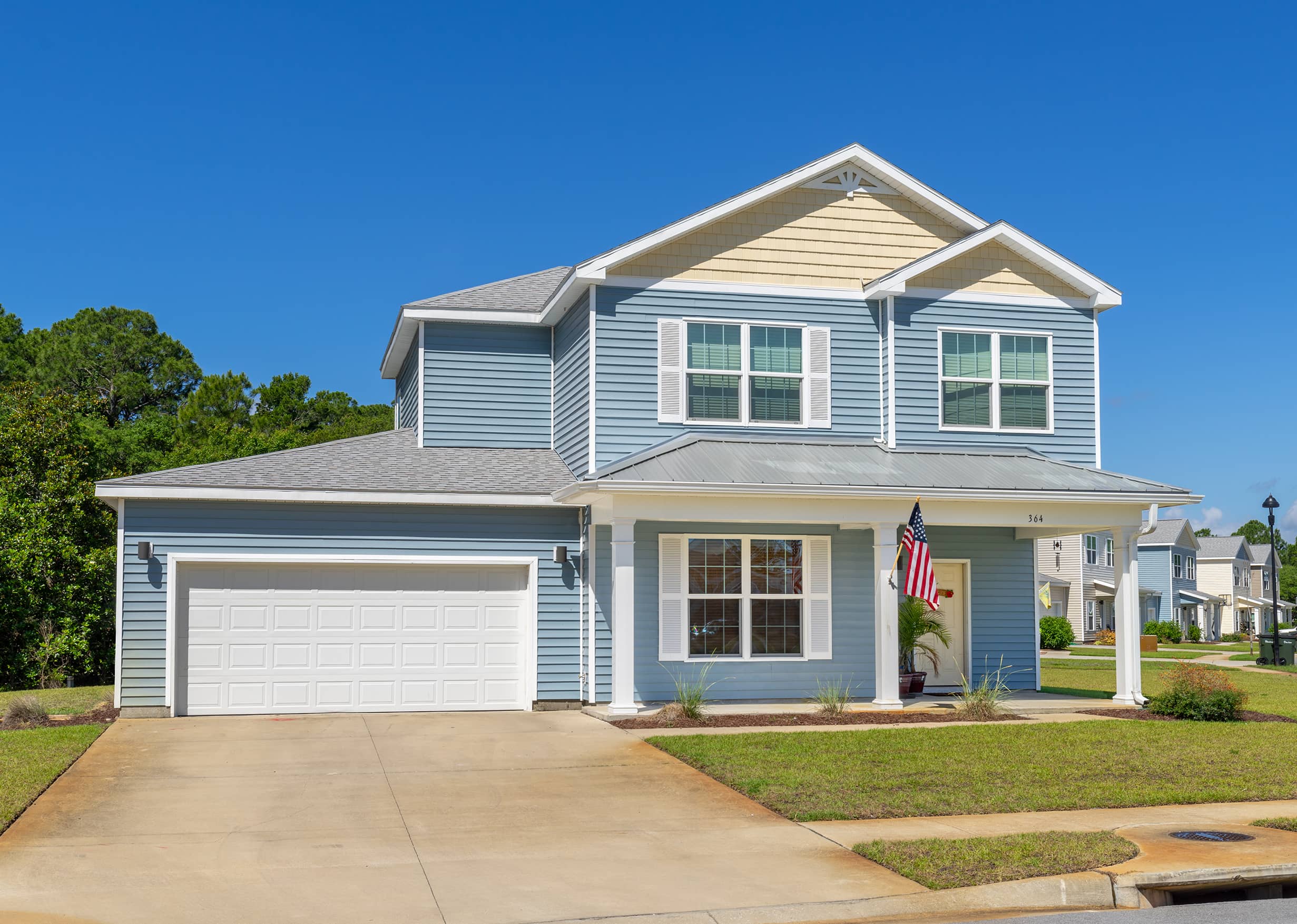 Outside of a house with an American flag