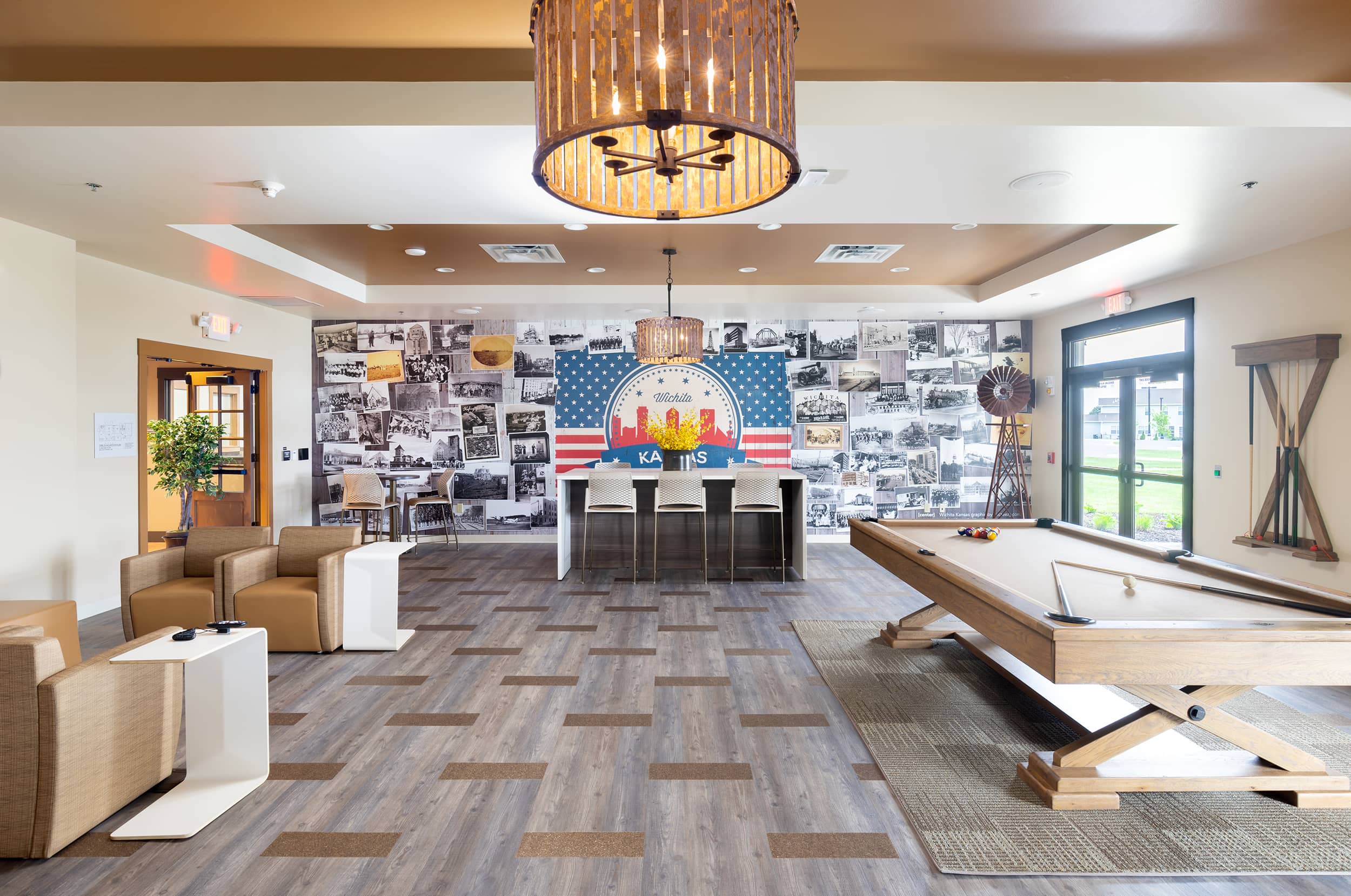Inside of a room with seating and a pool table