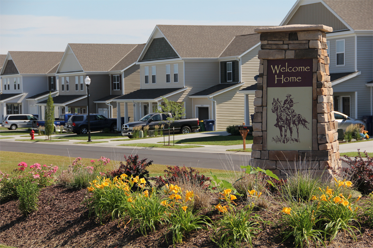 Community entrance with homes in the background