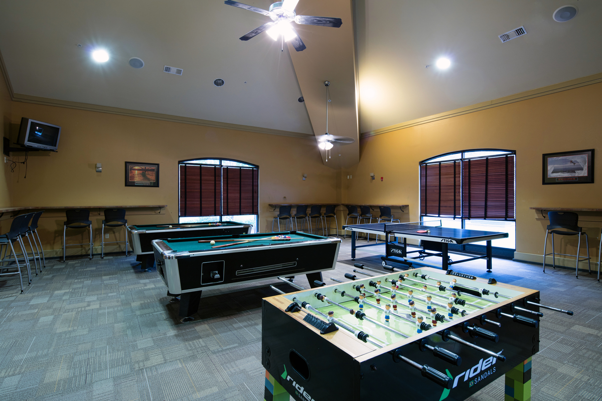 Pool and foosball tables in a game room
