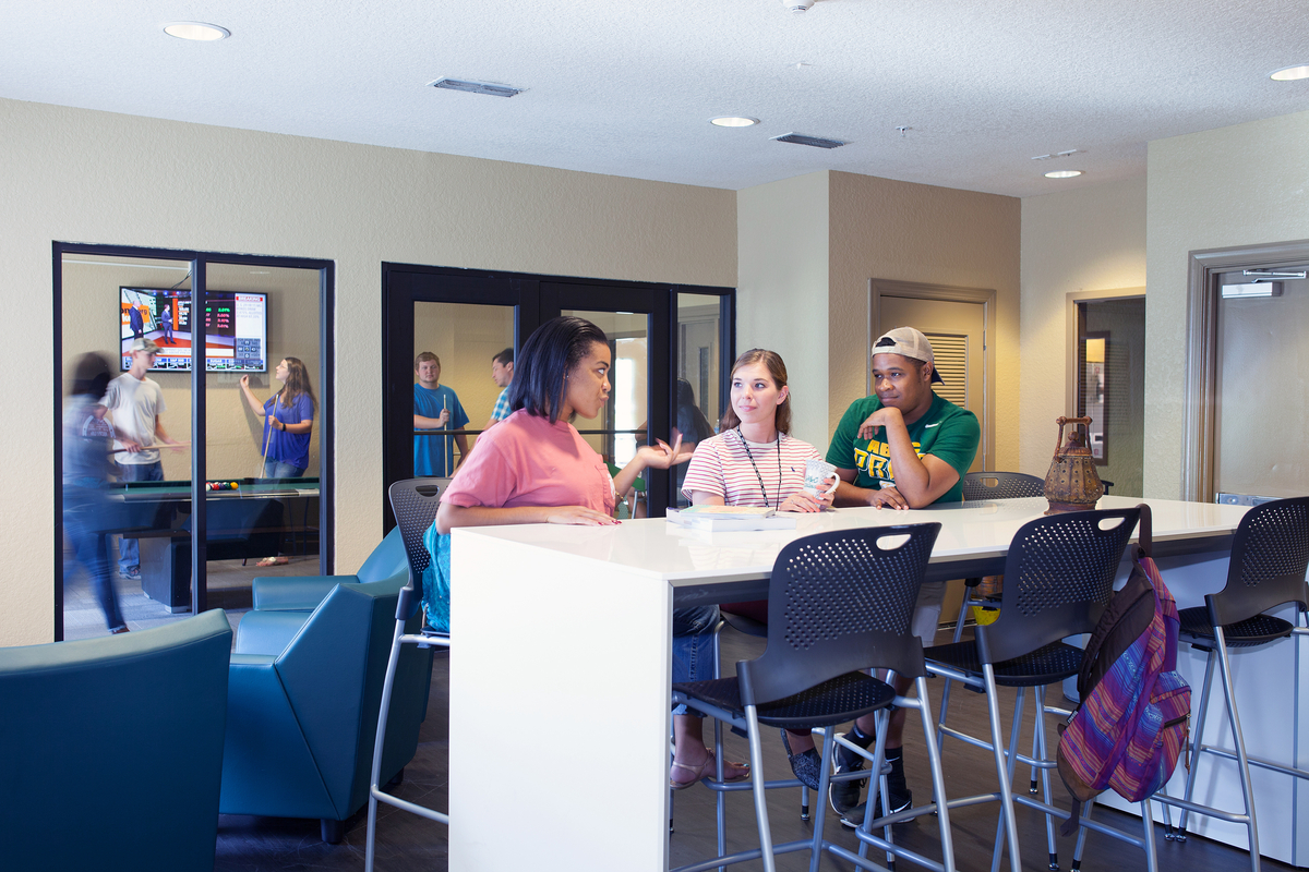 Students sitting at a table and talking