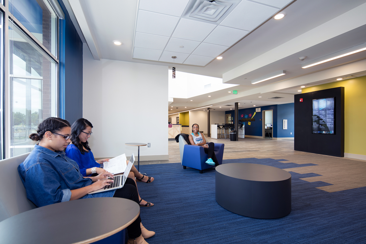 Three students sitting in a communal area
