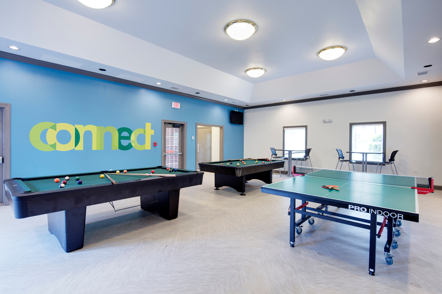 Game room with pool and ping pong tables