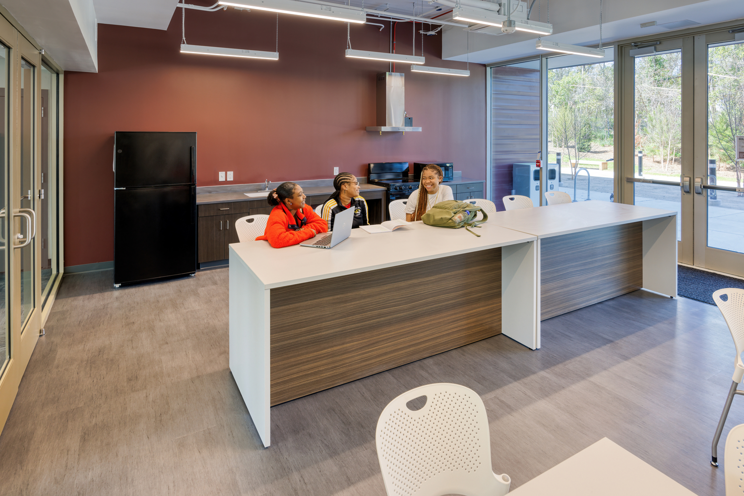 Three students sitting and talking 