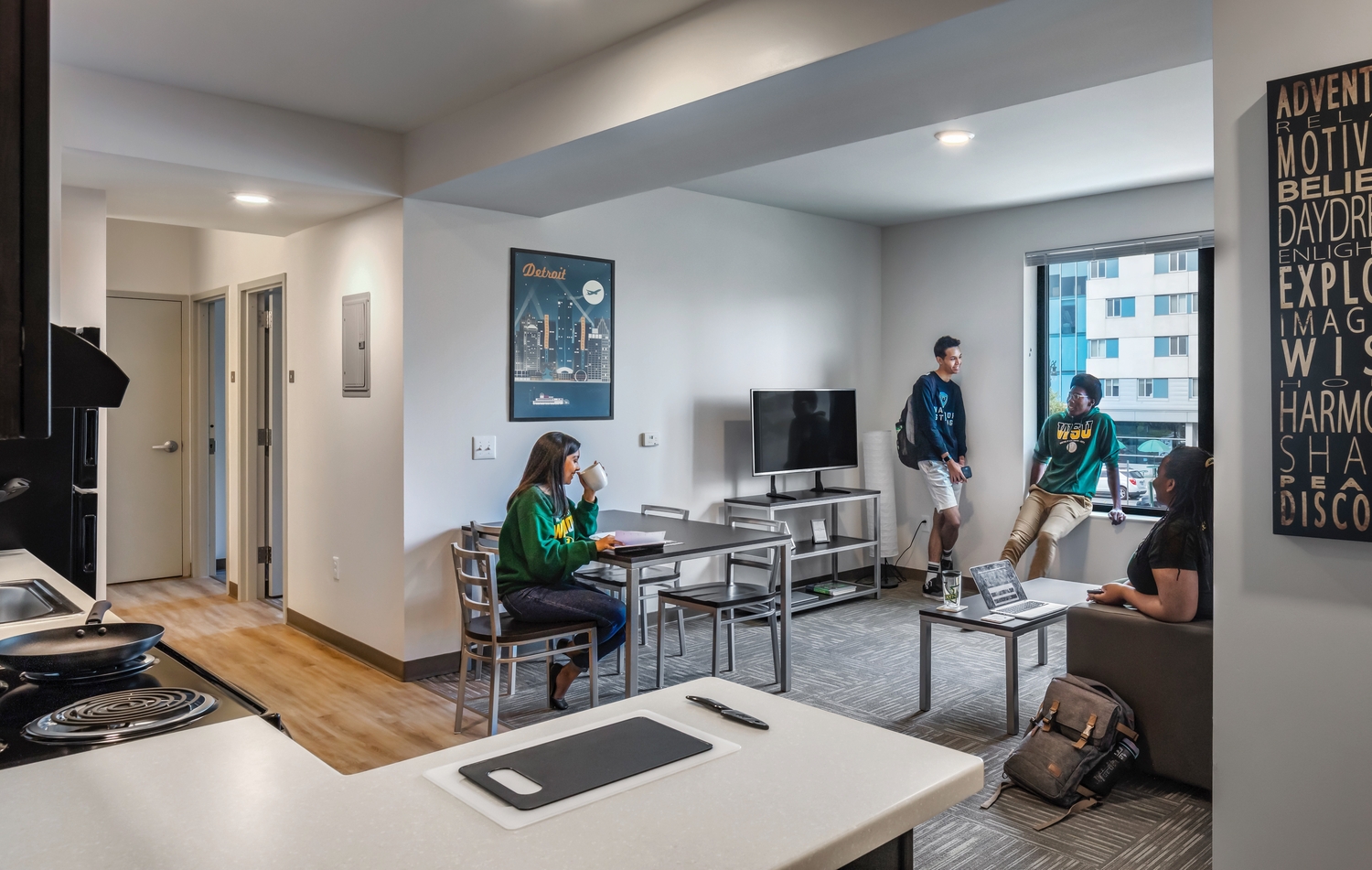 Students sitting in an apartment living room