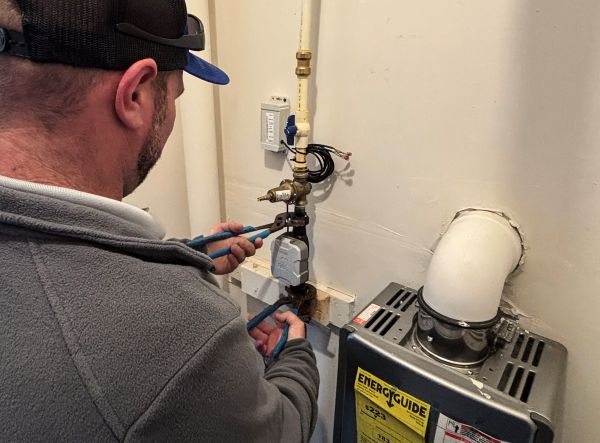 A Corvias technician checks a water meter at Aberdeen Proving Ground in Maryland