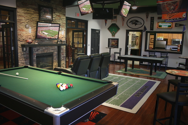 Room with TVs and pool table