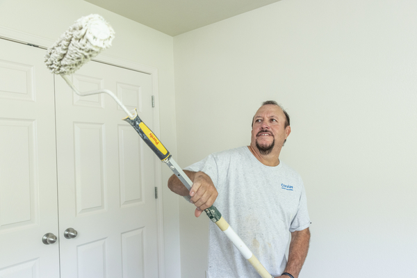 A Corvias team member prepares a home for new residents.