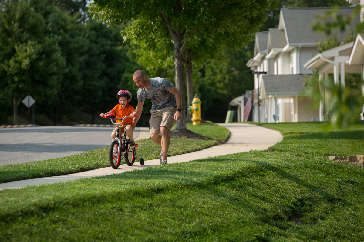 Father and Son Learning to Ride a Bike