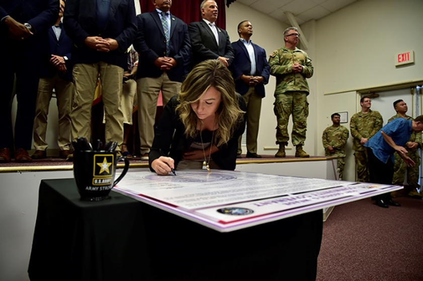 Brittney Dabney, Corvias Operations Director at Fort Meade participates in the 2023 Community Covenant Signing and Great American Defense Community Recognition event.