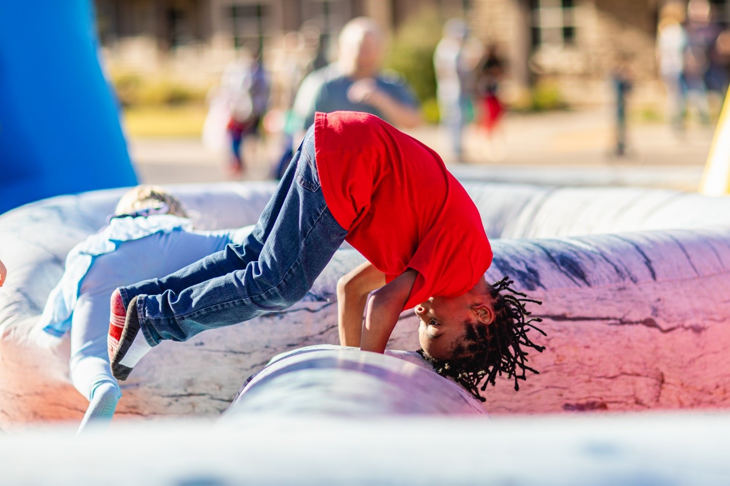 Child playing at event hosted by Corvias Property Management