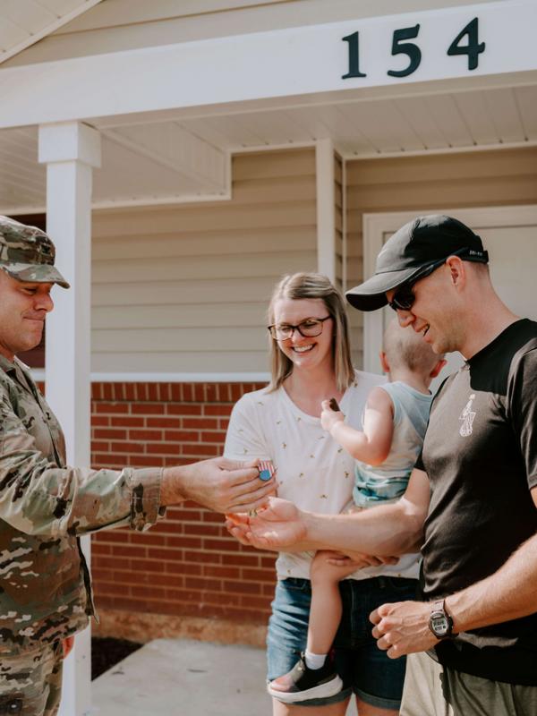 SSG Jared Wise, and family tour their newly renovated home at Munson Heights, Fort Rucker