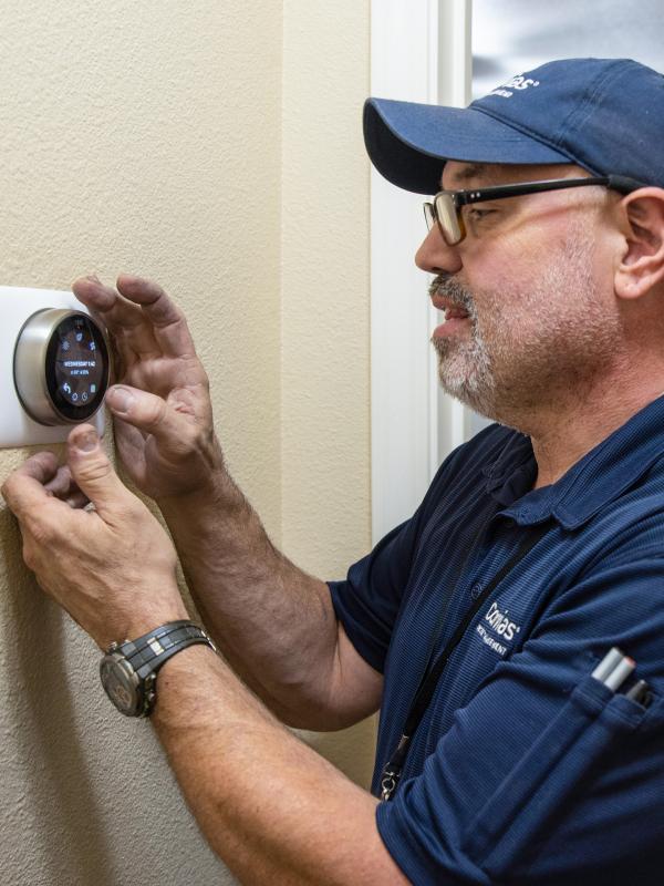 Man fixing thermostat