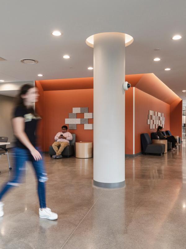 Young Lady walking through lobby