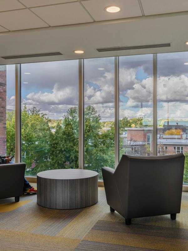 Woman sitting in fancy chair in living room