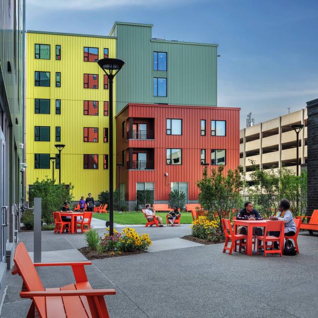 Patio with colorful buildings in the background