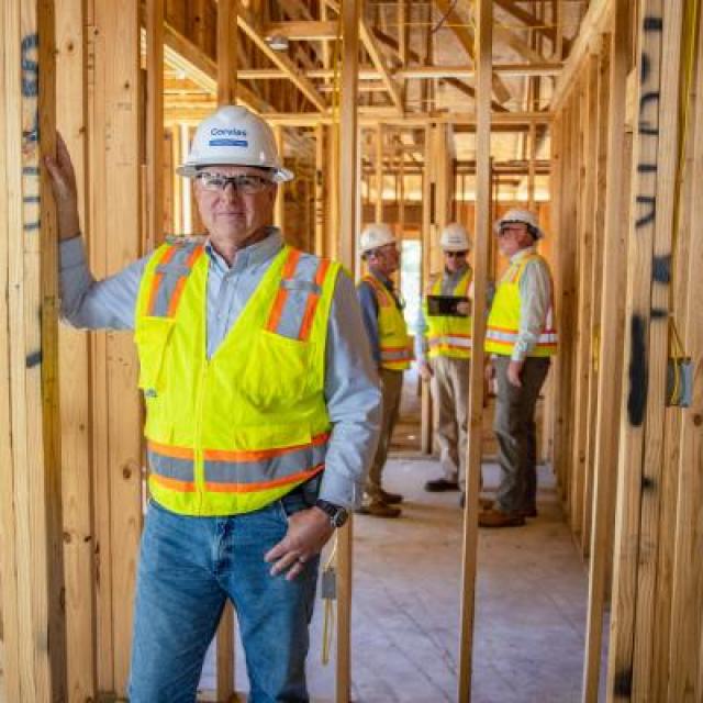 Man Constructing House