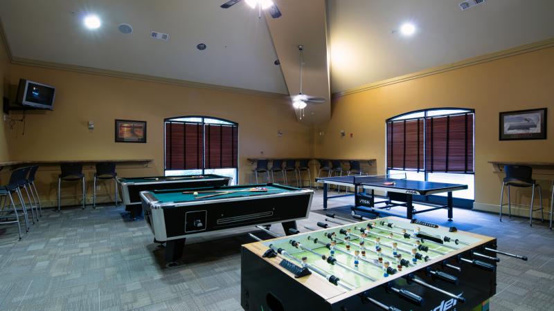 Game room with pool tables and foosball