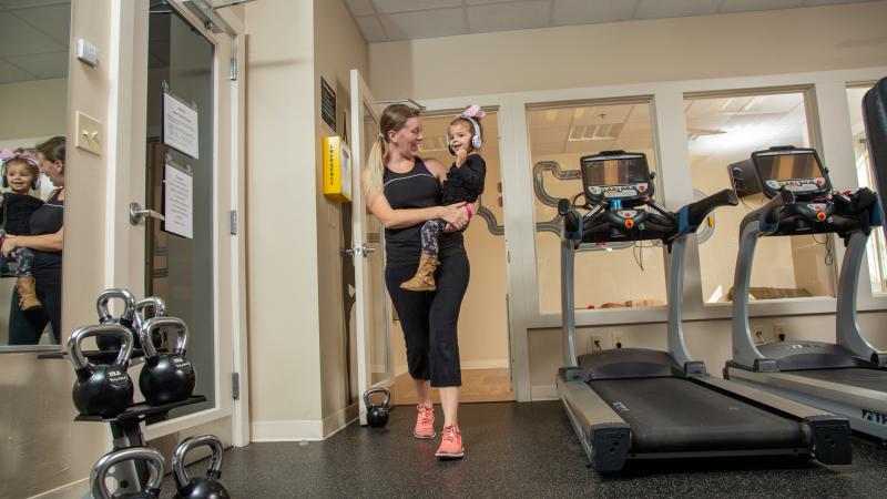 Mom and daughter enjoy the convenience of our private fitness room