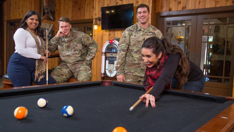 Soldiers enjoy a friendly game of pool at a Community Center