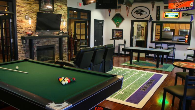 Community room with a fireplace and pool table