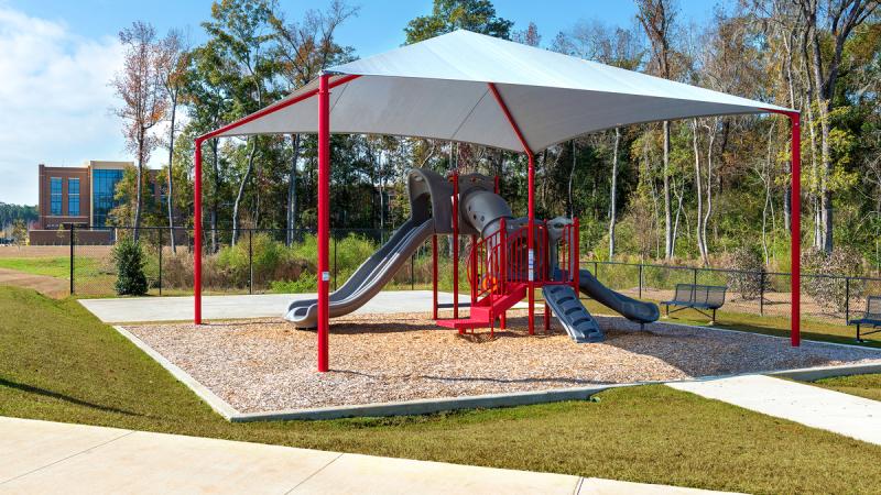 Outdoor playground next to woods