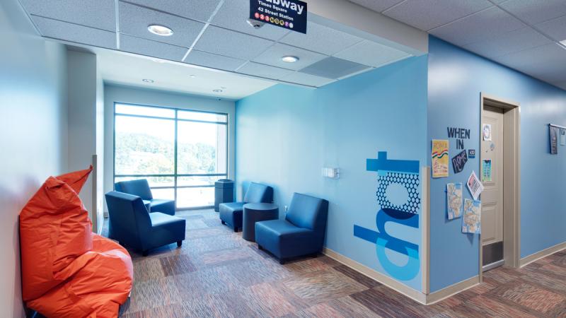 Building hallway with an enclave with chairs and a beanbag