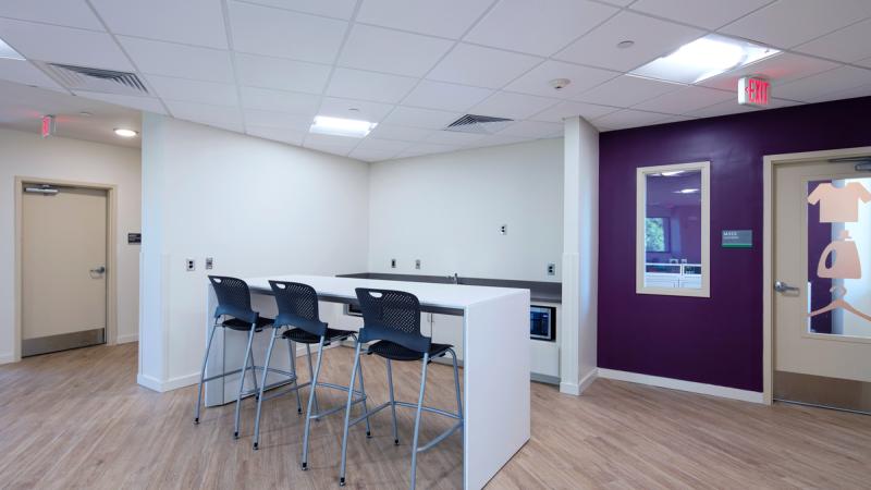 Empty community room with tables and chairs