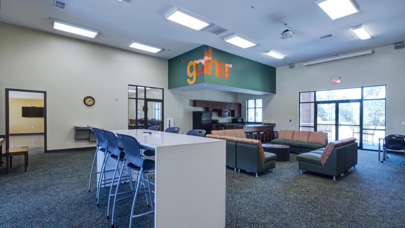 Community room with tables and chairs and couches