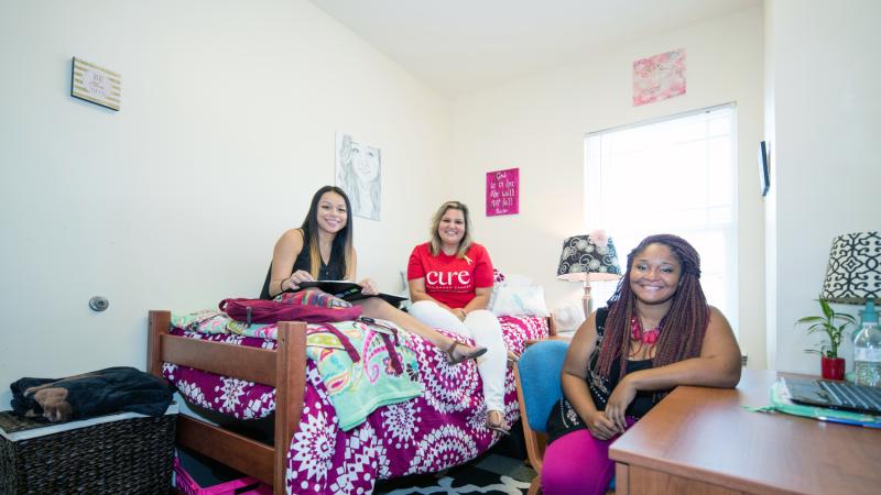Students sitting in a bedroom