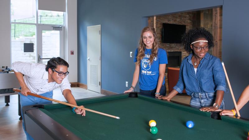 Students playing pool