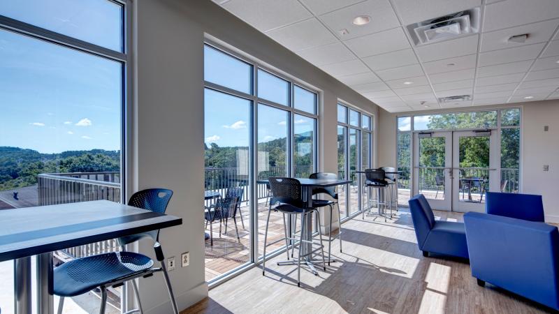 Bright and open room with tables and seating