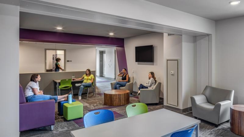 Common area with seating and students studying