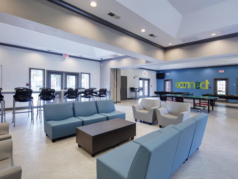 Community room with game tables and seating