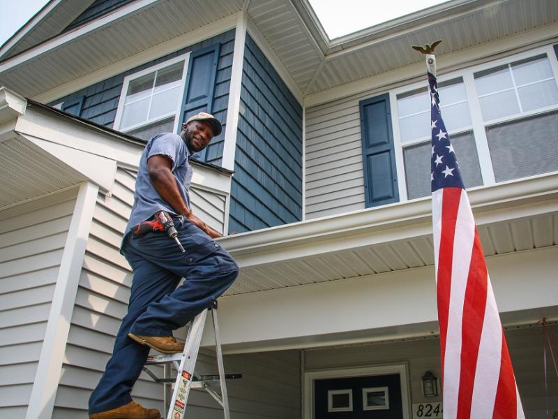 Meade Maintenance technician Al Green working on military home