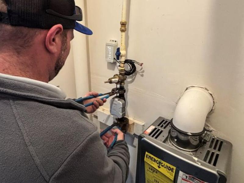 A Corvias technician checks a water meter at Aberdeen Proving Ground in Maryland