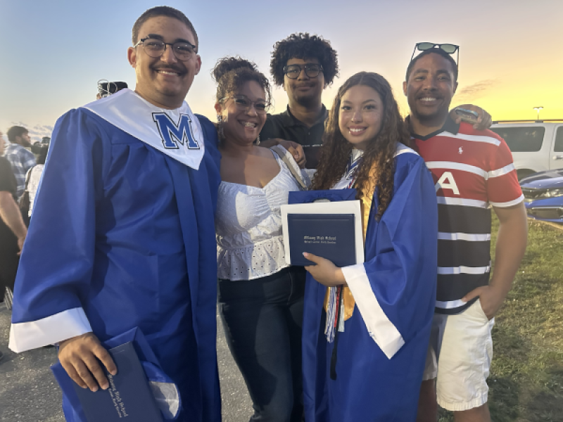2025 scholarship recipient, Ciara Henley with her family, including parent Charles Henley, Assistant Resident and Leasing Manager at Fort Bragg.