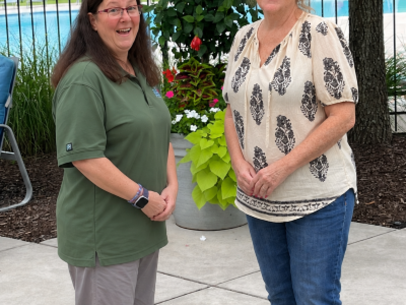Susan Laferriere (right), a resident at APG, talks with her good friend, Gayle Fears, a Corvias Resident Associate., 