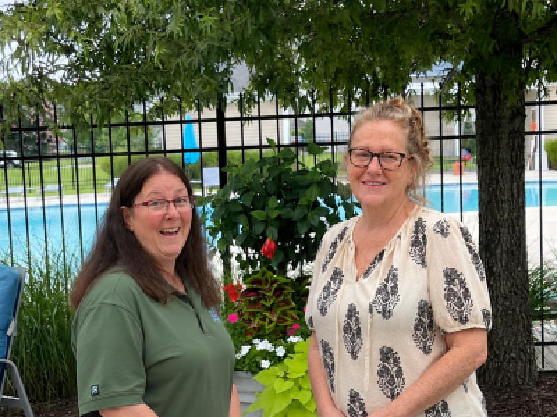 Susan Laferriere (right), a resident at APG, talks with her good friend, Gayle Fears, a Corvias Resident Associate., 