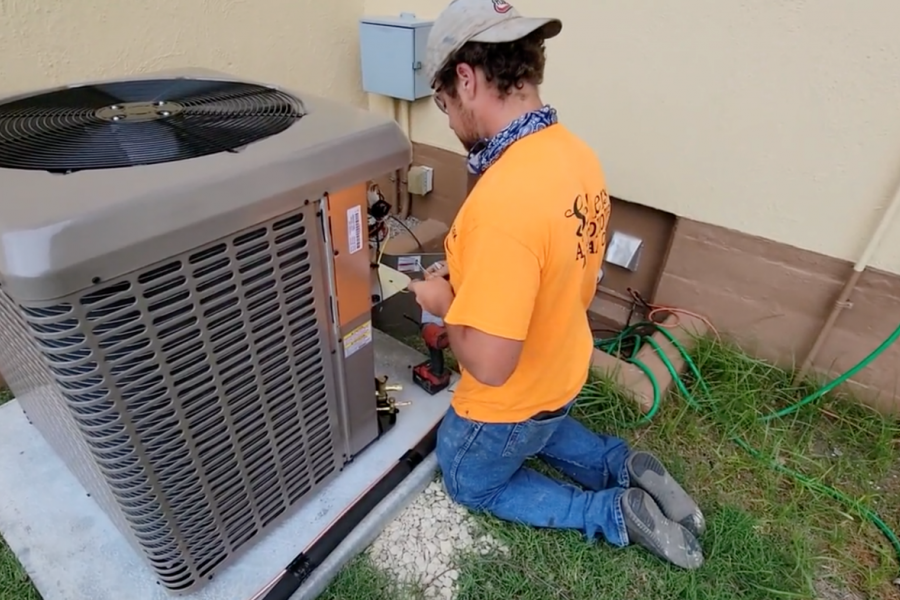 Fort Sill Maintenance Worker installs HVAC unit
